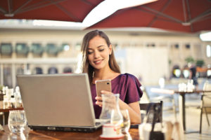 Woman doing taxes on laptop