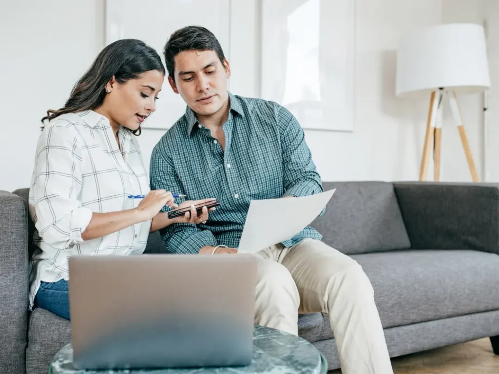 A couple reviews their taxes so they can ensure their small businesses taxes are filed accurately.