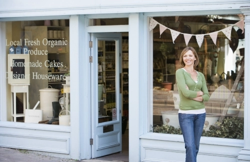 A sole proprietor, a female shop owner, proudly discusses the difference between sole proprietor and LLC